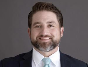 STOLTZ JOINS FIRST COMMUNITY BANK