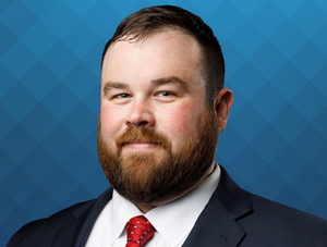 FIRST COMMUNITY BANK PROMOTES TAYLOR